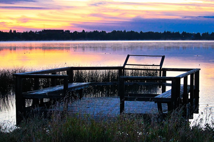 A bird viewing platform at sunrise over Jessie Lake