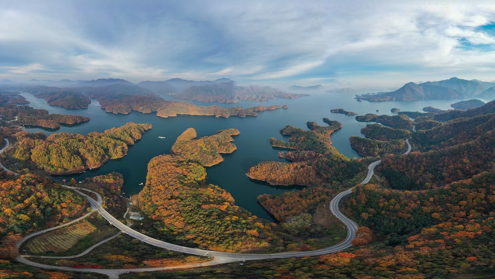 Panorama view of beautiful mountains in autumn at Chungju Lake, South Korea.