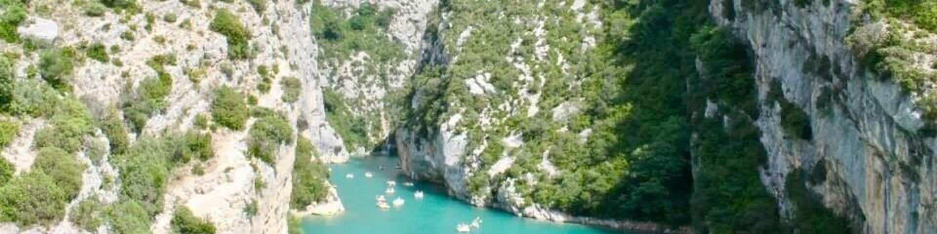 This is a beautiful gorge about 10mins beyond the village of Moustiers sainte marie, in Provence. The waters are peppered with people kayaking, paddle boating & swimming!