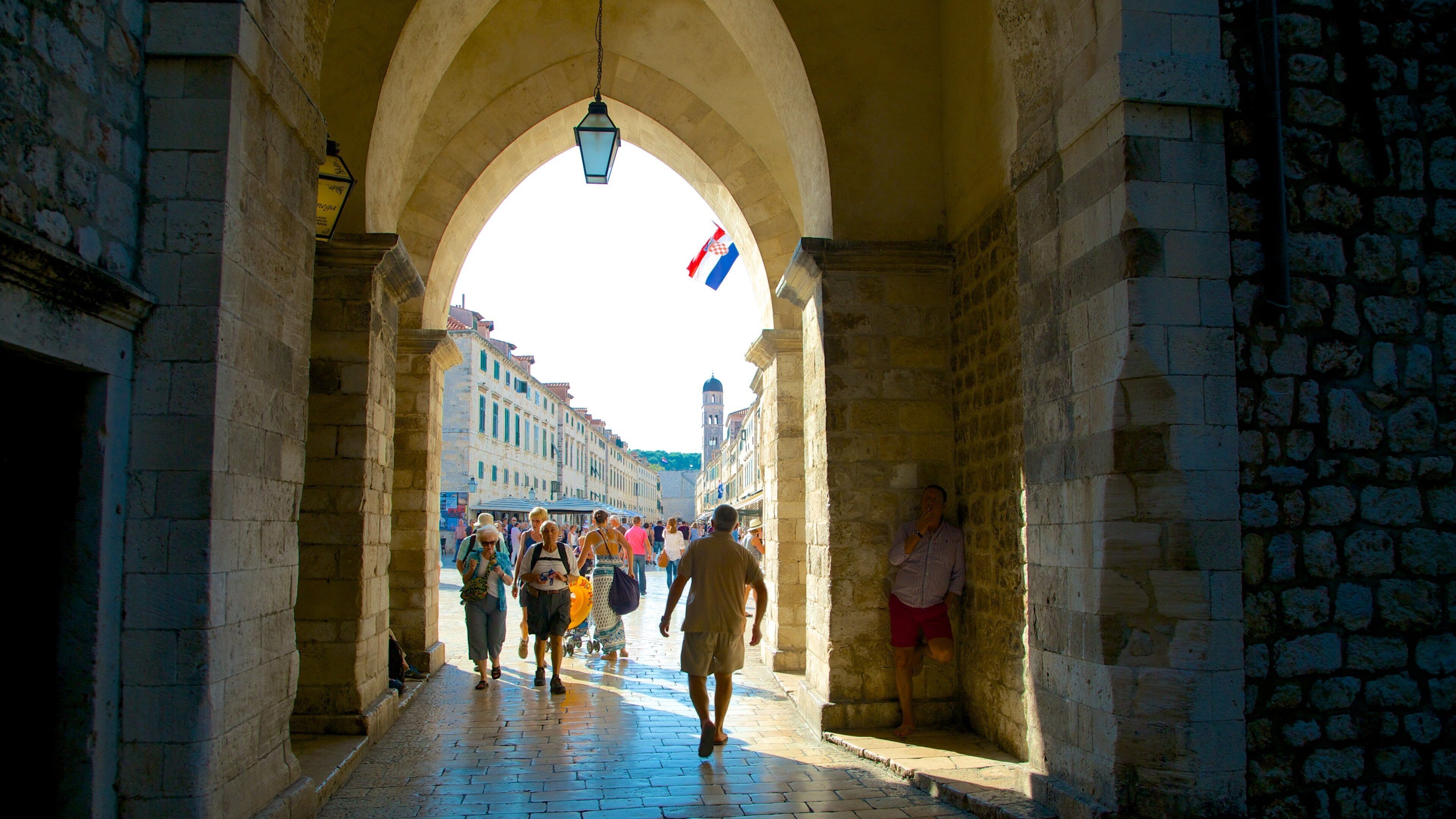 Stradun showing heritage architecture as well as a small group of people
