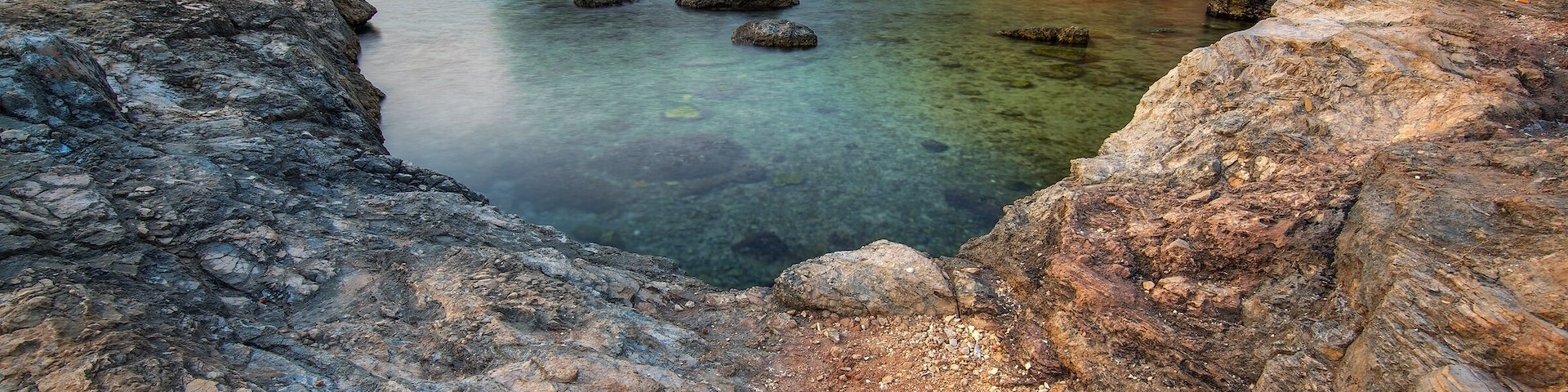 Porto Selvaggio, is a beautiful marina in the town of Nardo, located on the Ionian coast of the province of Lecce. This location is particularly important from an environmental point of view, as the territory is included within the "Parco Naturale Regionale di Porto Selvaggio e Palude del Capitano" It is a particularly cliff coasts surrounded by lush vegetation, which is why one has the impression of being in a beautiful place in the mountains just a short walk from the sea. It has a beautiful and charming bay on which to spend an unforgettable day by the clear sea and colorful. From the bay you can see, on your right Torre Uluzzo, on the left of the High Tower and very close to a small beach, characterized by the fact that in some places, swimming, you can meet freshwater springs. It is a place much loved for its splendor, full of very rugged rocky bays and natural coves, alternating with short stretches of sand.