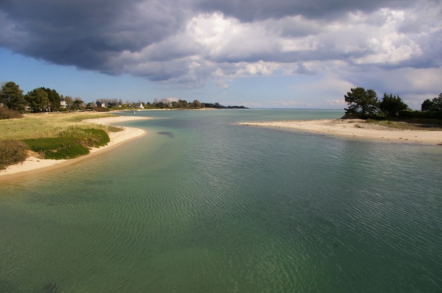 Stormy clouds above the mouth of La Saire river near Reville, Normandy, France