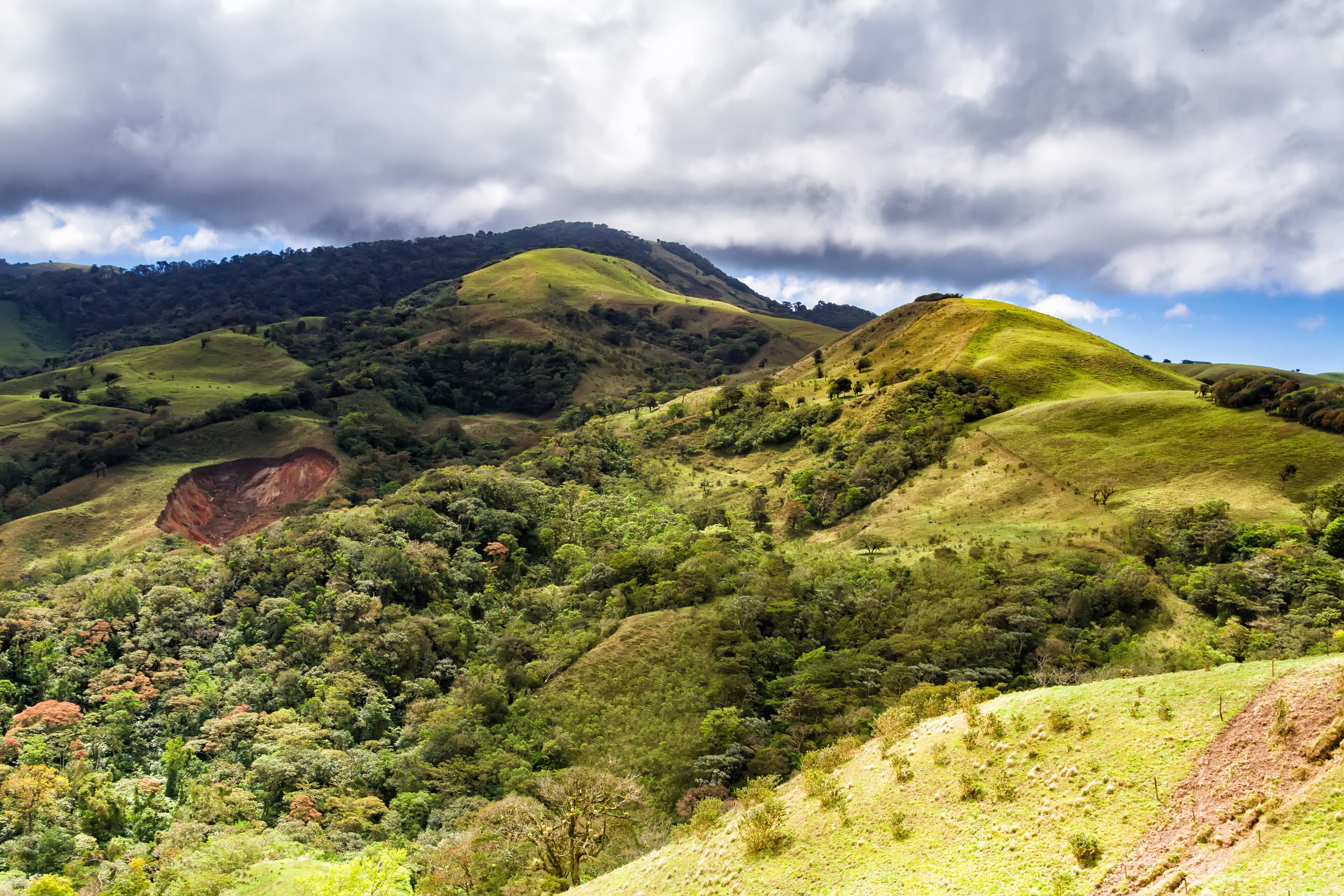 Monteverde, Santa Elena and Arenal area in Costa Rica highlands. Panoramic view in sunny day of a vast hills and mountains in this pristine region of Central America