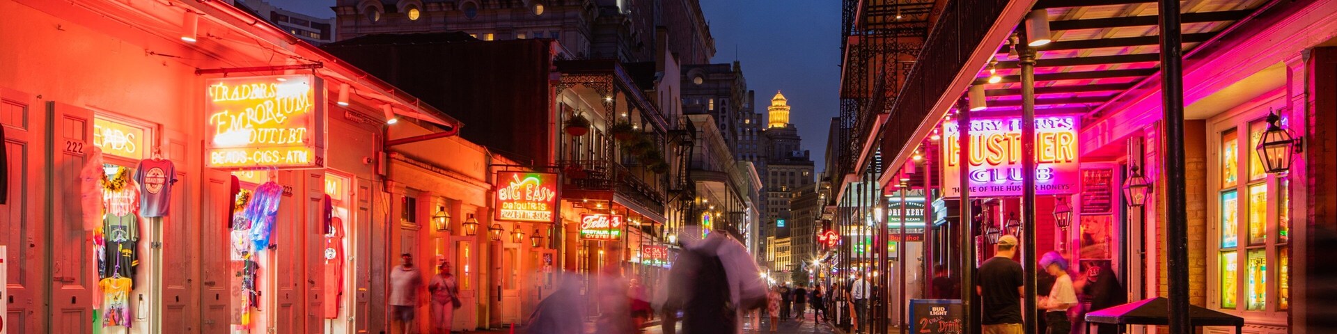 Bourbon Street which includes night scenes, a city and street scenes