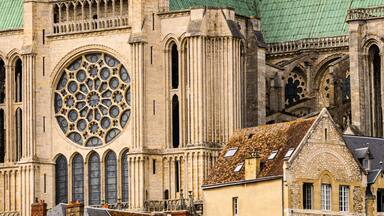 A historic cathedral with intricate Gothic architecture, including pointed arches and a large rose window.