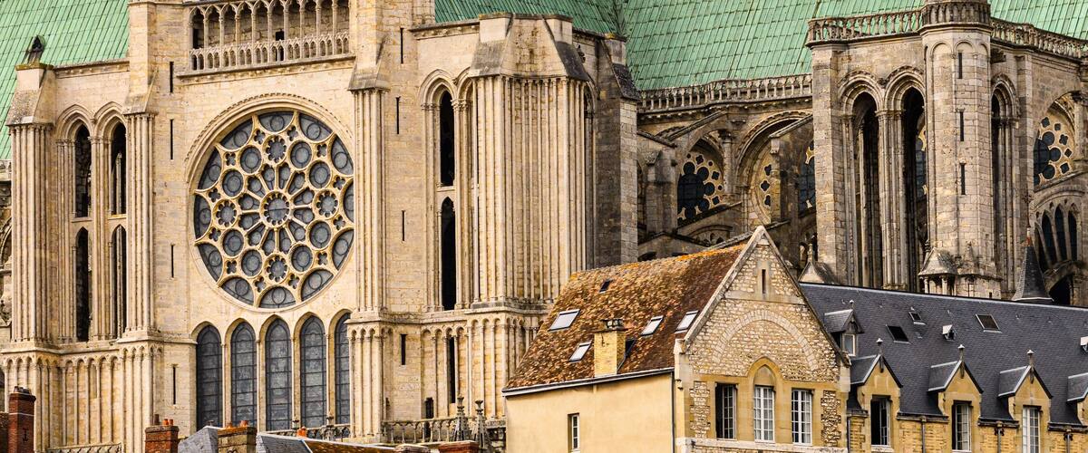 A historic cathedral with intricate Gothic architecture, including pointed arches and a large rose window.