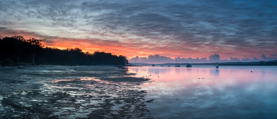 Sunrise Waterscape Panorama with High Cloud, Boats and Reflections