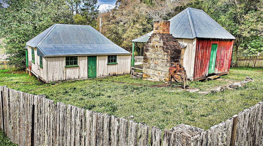THE DIVERSION
Minnamurra Falls is a fairly well known slice of the national park scene on the south coast. The people whose house I was sitting had suggested it; it had rained; it was all coming together. So I lit out, hope springing eternal, winding along the delightful Jamberoo valley flushed green with the recent precipitation.
There were pictures to be had en route, slab huts among them. I was having a ball. Then it all came to an abrupt end when I arrived at the entrance to the waterfall complex. The ranger wanted money. I had a pass but I’d left it in my motorhome and was bemoaning that fact when the ranger bade me to listen and explained that, despite the recent rains, the creek was the same height as it had been a few days earlier, i.e. hardly any flow
(continued)