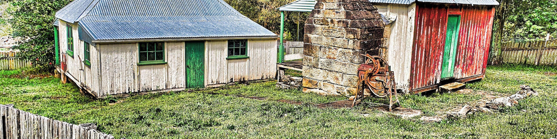 THE DIVERSION
Minnamurra Falls is a fairly well known slice of the national park scene on the south coast. The people whose house I was sitting had suggested it; it had rained; it was all coming together. So I lit out, hope springing eternal, winding along the delightful Jamberoo valley flushed green with the recent precipitation.
There were pictures to be had en route, slab huts among them. I was having a ball. Then it all came to an abrupt end when I arrived at the entrance to the waterfall complex. The ranger wanted money. I had a pass but I’d left it in my motorhome and was bemoaning that fact when the ranger bade me to listen and explained that, despite the recent rains, the creek was the same height as it had been a few days earlier, i.e. hardly any flow
(continued)