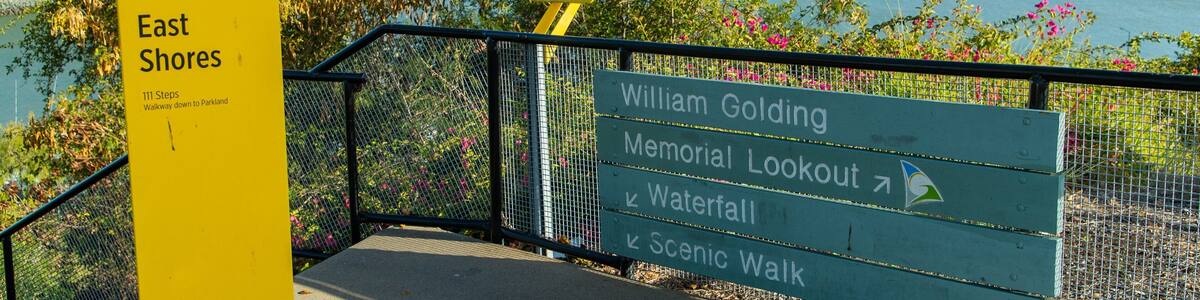 A signpost with directions to East Shores, William Golding Memorial Lookout, Watertfall, and Scenic Walk.