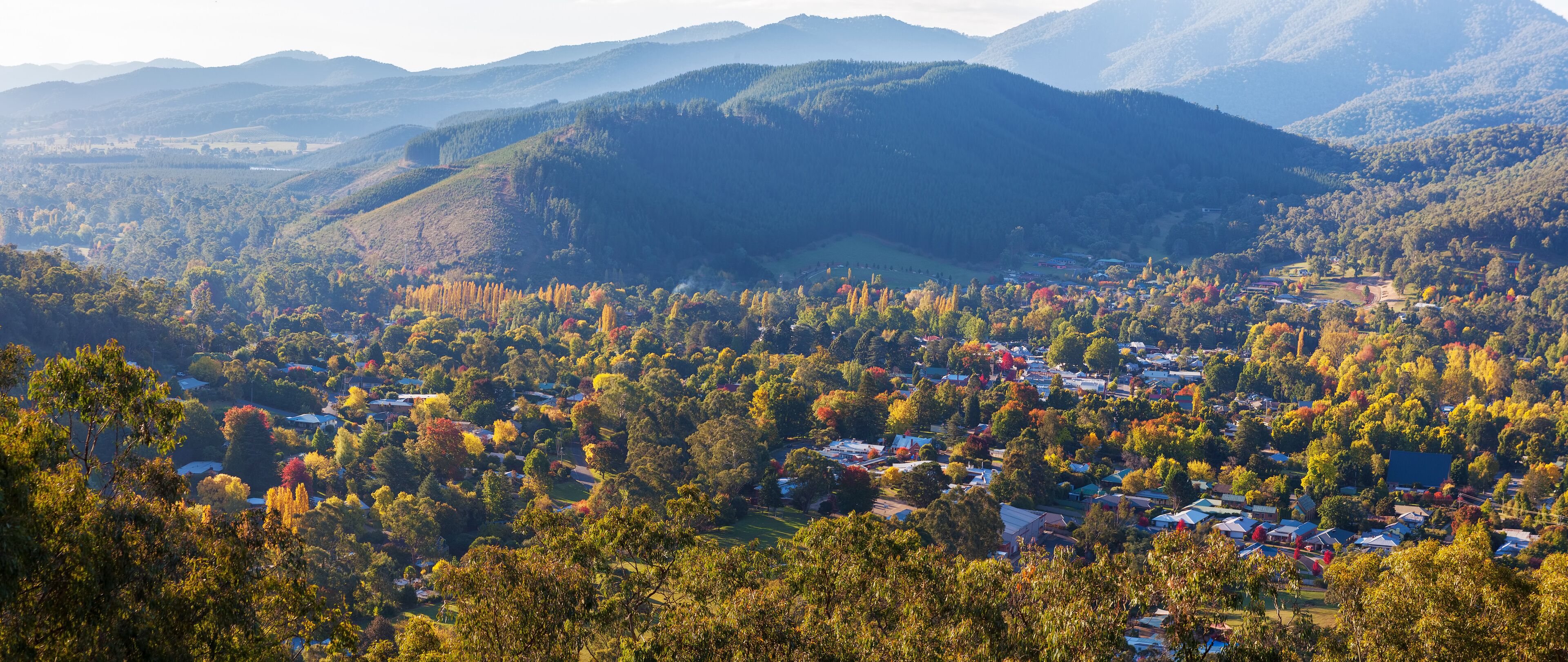 Beautiful countryside town in autumn aerial panorama - Bright, Victoria, Australia