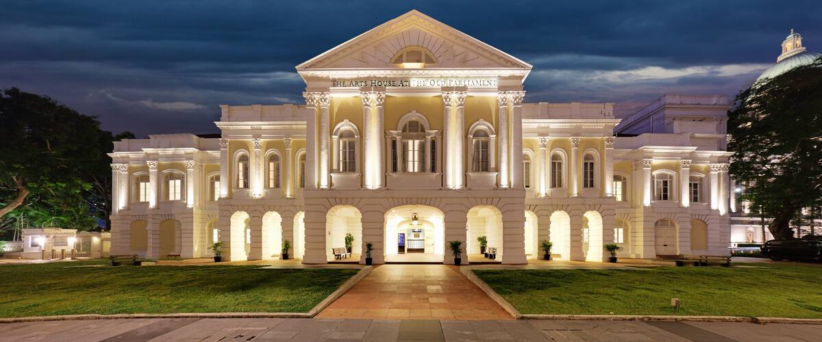 The Arts House at The Old Parliament building with classical architecture and a well-lit facade.