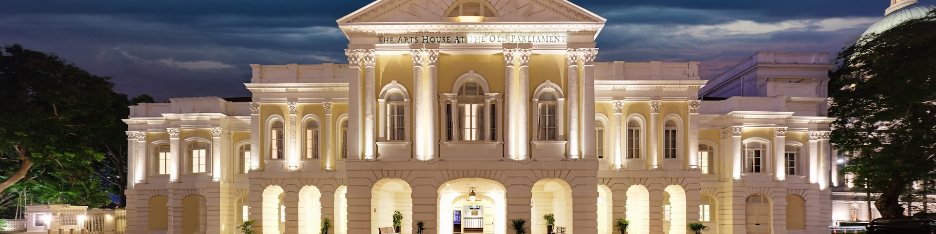 The Arts House at The Old Parliament building with classical architecture and a well-lit facade.