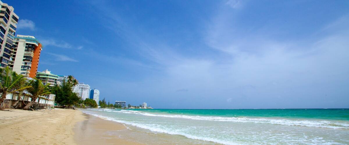 Isla Verde showing a sandy beach and a coastal town