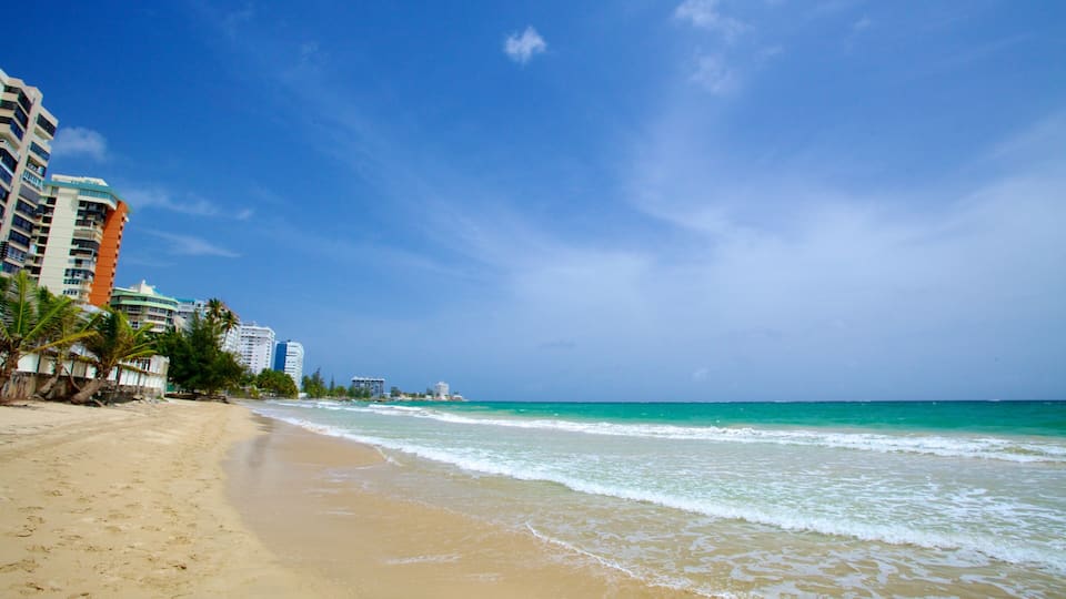 Isla Verde Beach showing a beach and a coastal town