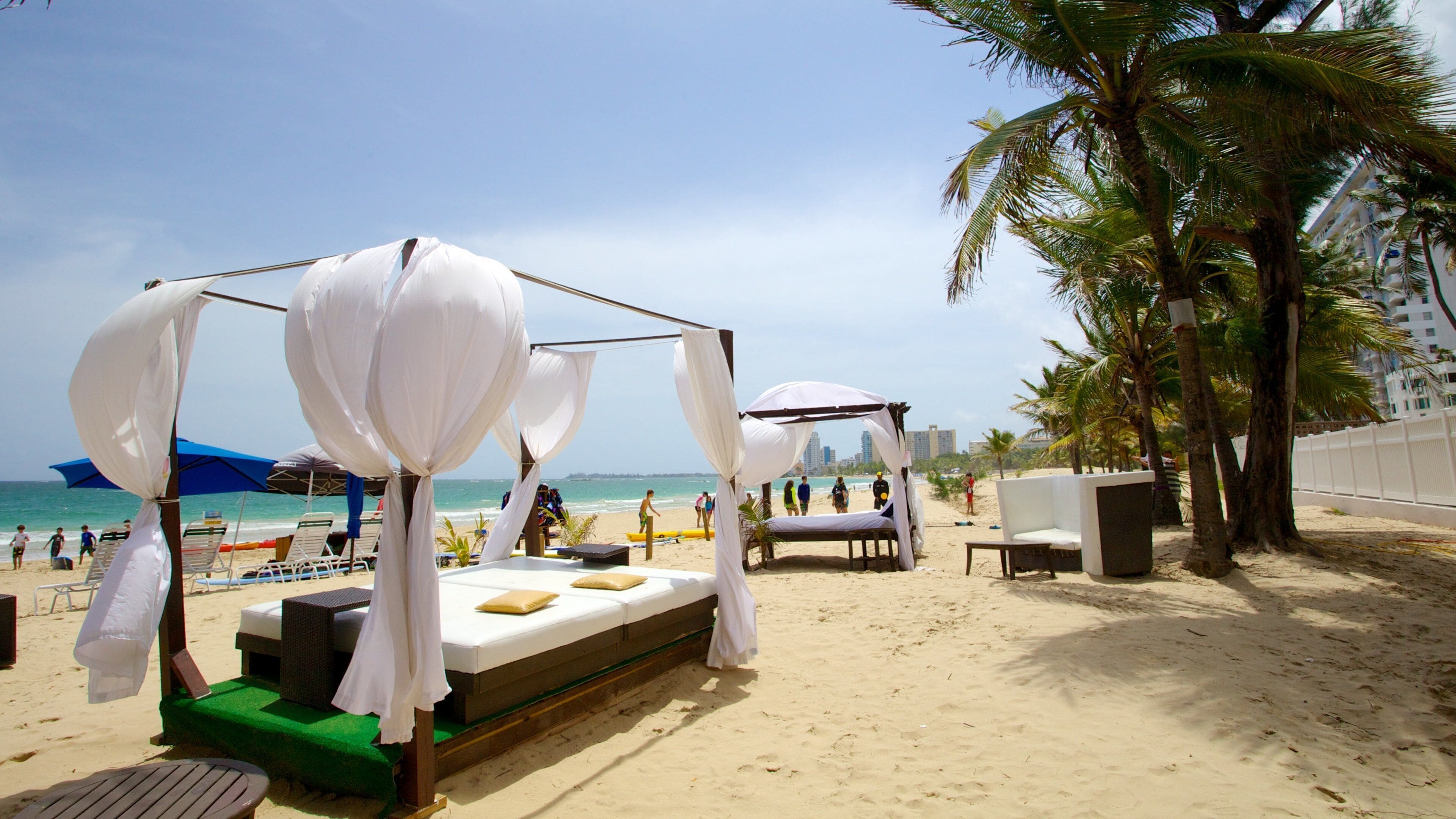 Isla Verde Beach showing a sandy beach, tropical scenes and a luxury hotel or resort