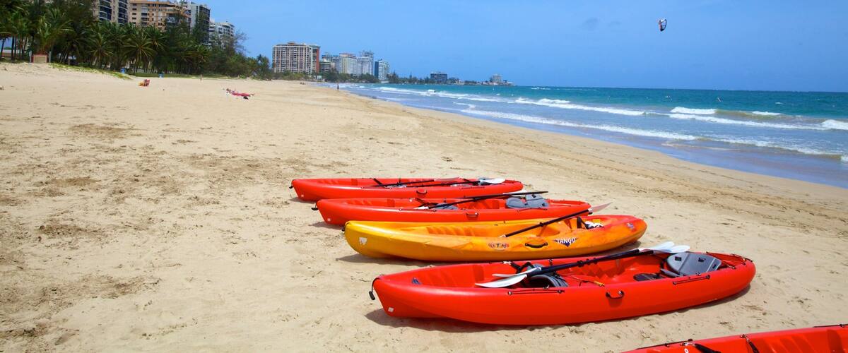 Isla Verde Beach featuring kayaking or canoeing and a beach