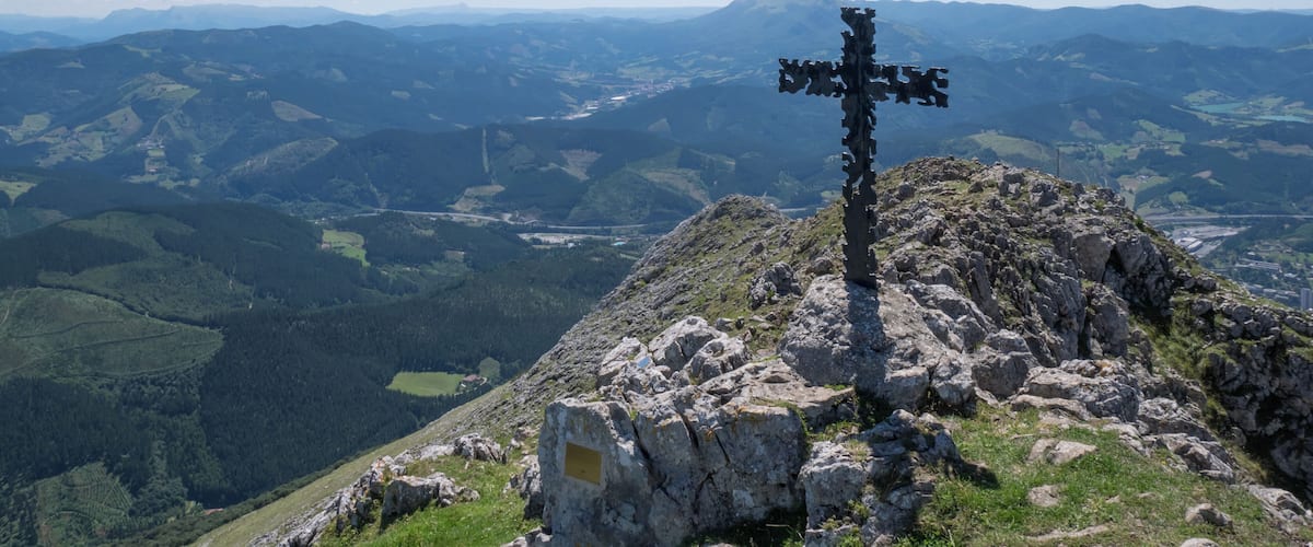 Summit cross of Udalaitz mountain. Basque Country, Spain