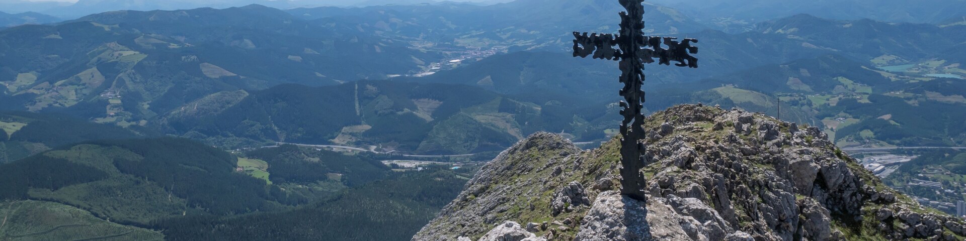 Summit cross of Udalaitz mountain. Basque Country, Spain