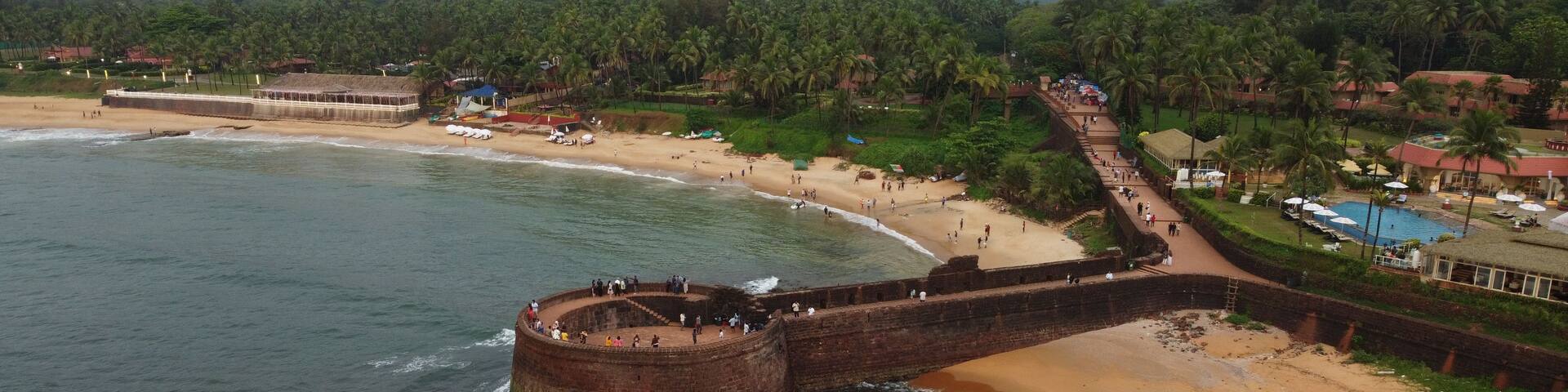 A coastal fortification with a beach in the background.