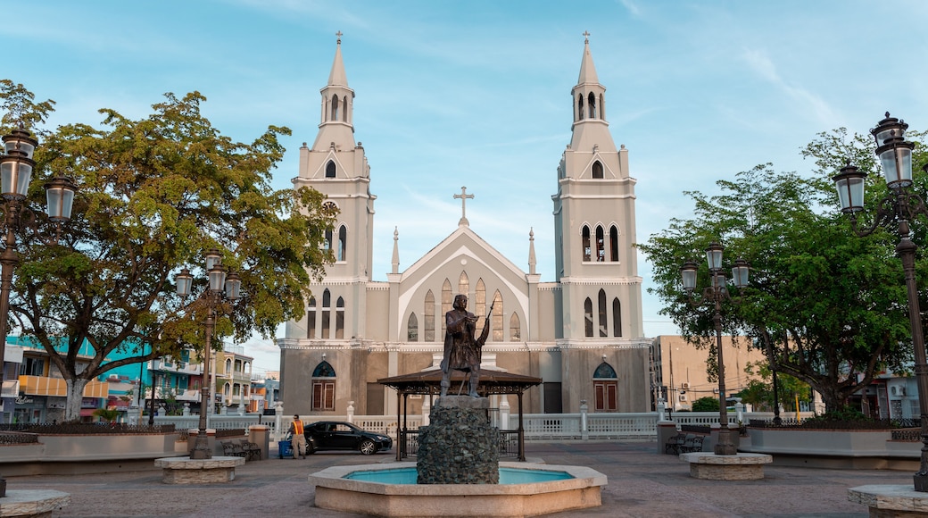 Statue of Christopher Columbus and an ancient church at the square of Aguada, Puerto Rico