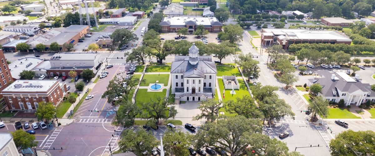 Aerial view of beautiful courthouse surrounded by greenery and historic buildings in downtown Thomasville, Georgia, United States.