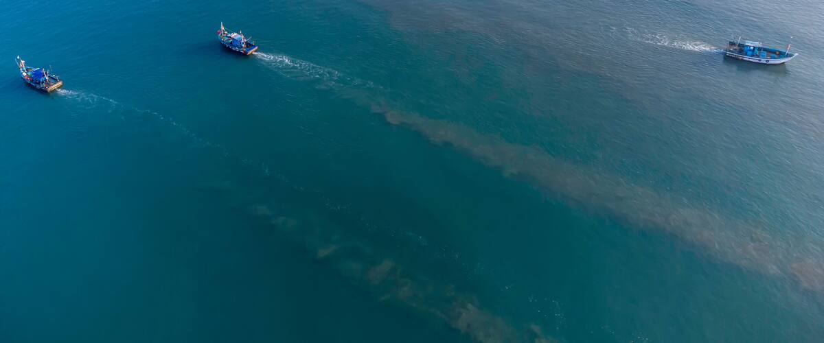 Aerial view of fishing boats off Betalbatim beach at South Goa, located on the West Coast of Maharashtra India.