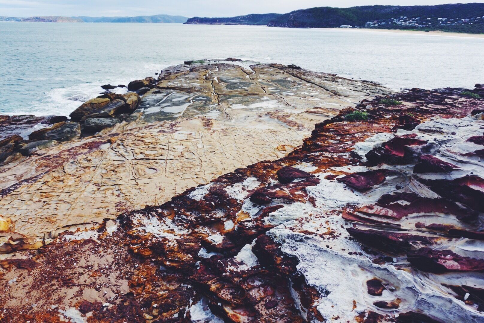 Putty Beach, in Bouddi National Park has amazing rock formations accessible from the beach in such beautiful #colours . Park at the beach or #hike here as part of the coastal route. #hiking #australia #nsw 