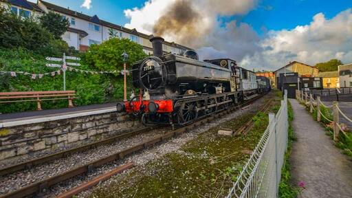 Gala day on the West Somerset Railway and an early morning steam hauled goods train passes Watchet station.