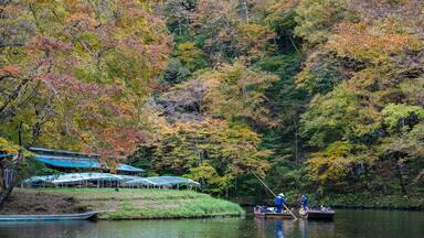 Geibikei Gorge River Cruises in Autumn foliage season. Beautiful scenery landscapes view in sunny weather day. Ichinoseki, Iwate Prefecture, Japan
