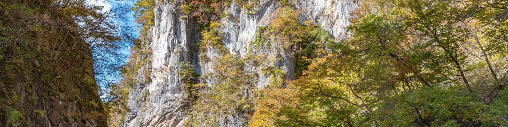 Geibikei Gorge River Cruises in Autumn foliage season. Beautiful scenery landscapes view in sunny weather day. Ichinoseki, Iwate Prefecture, Japan