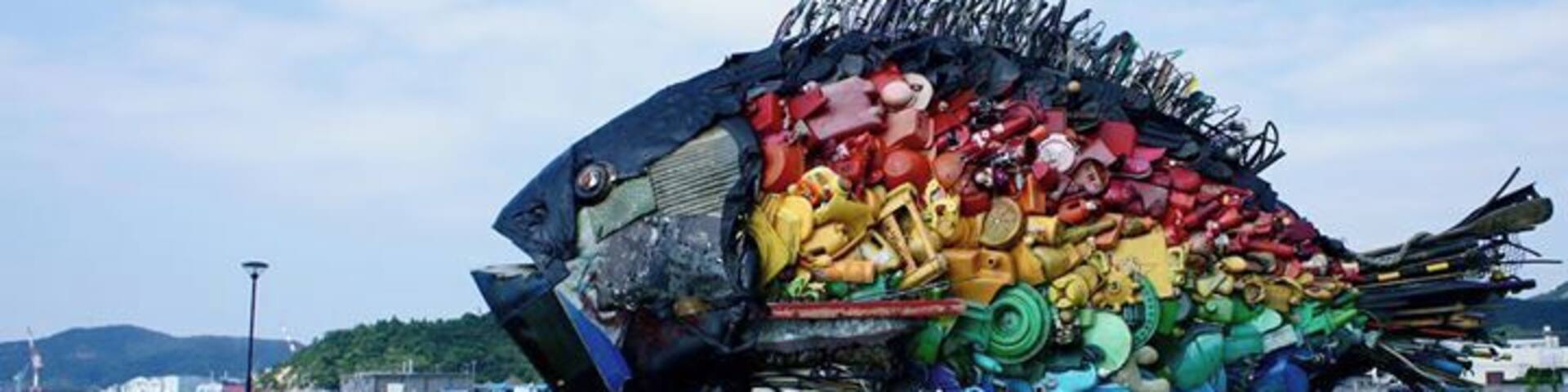 Big fish, made from garbage, near the port