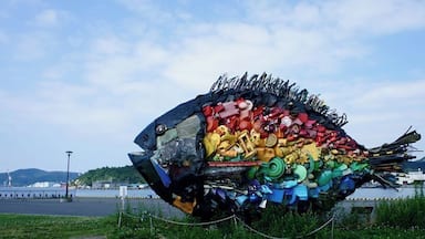 Big fish, made from garbage, near the port