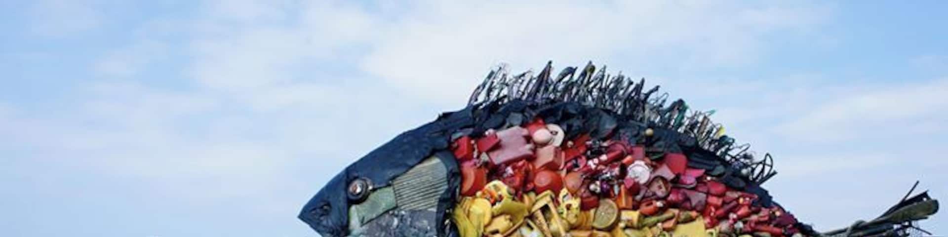 Big fish, made from garbage, near the port