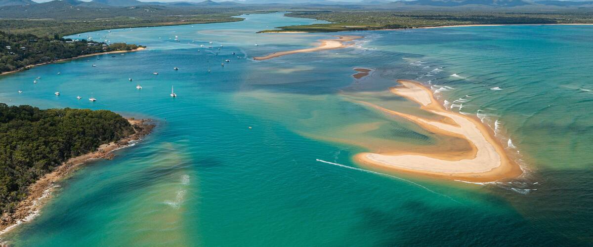 Seventeen Seventy which includes a beach, general coastal views and island views