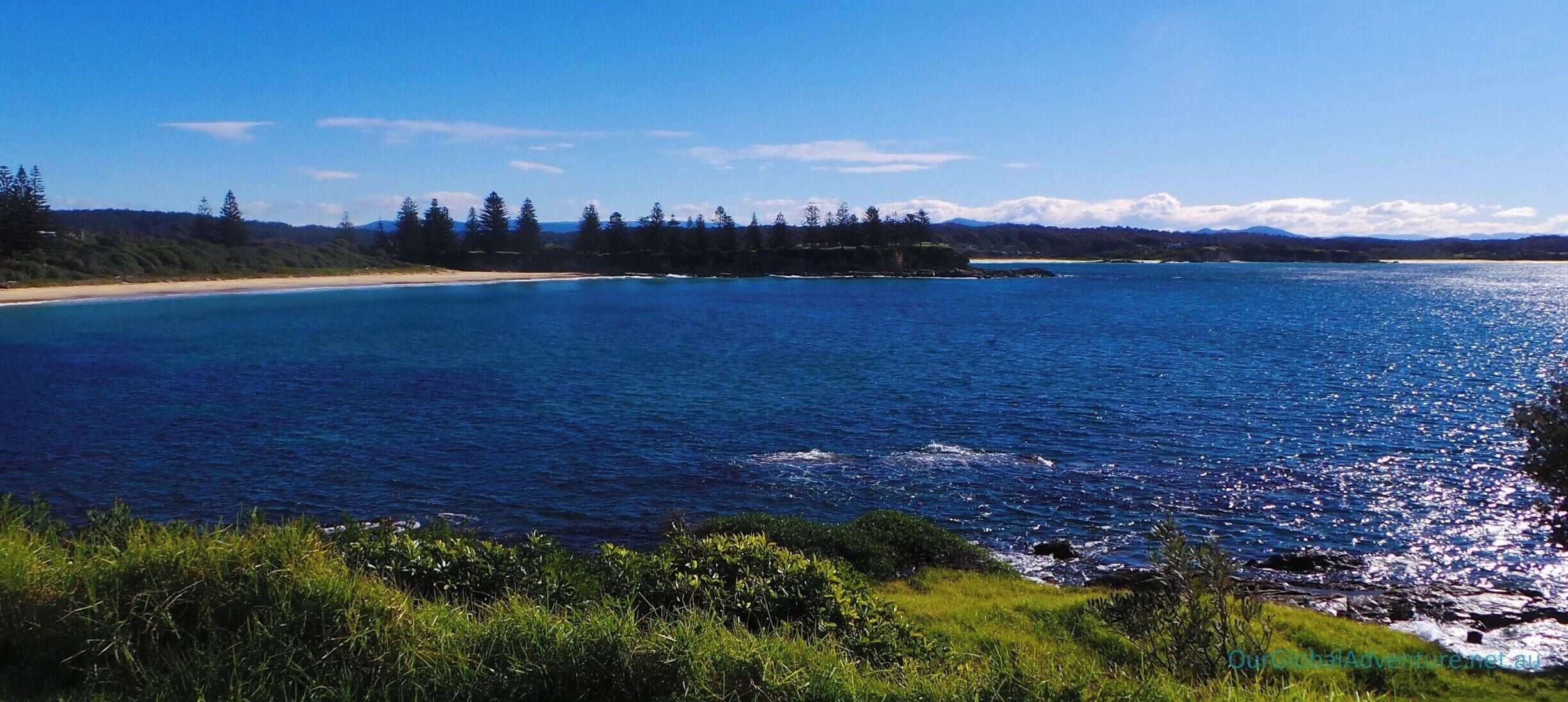 Beautiful coastal scenery and perfect swimming at Bermagui Main Beach and the nearby Blue Pool.