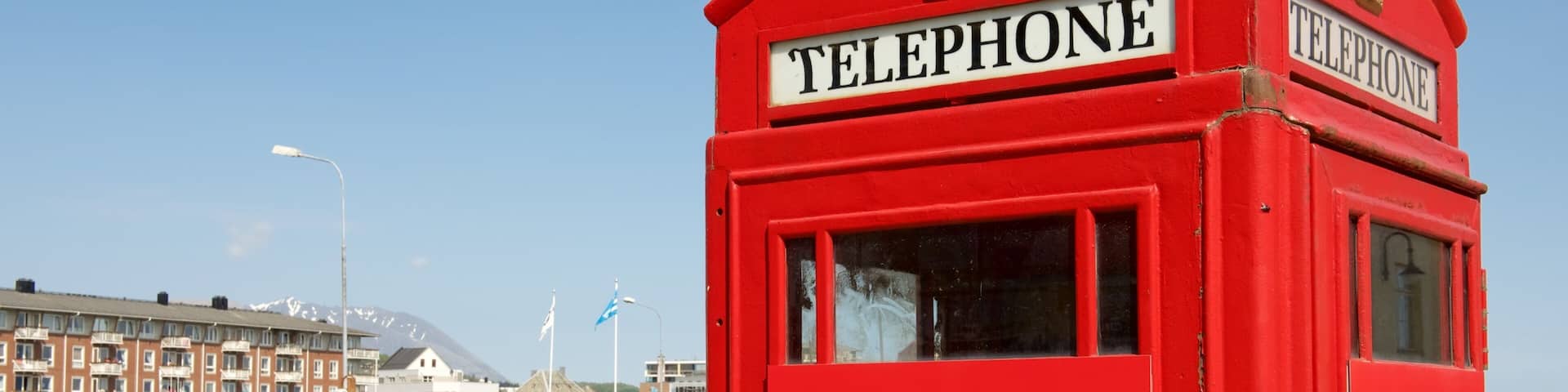 Harstad featuring a coastal town and signage