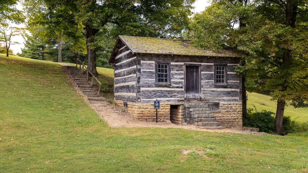 Antique small wood cabin spring house