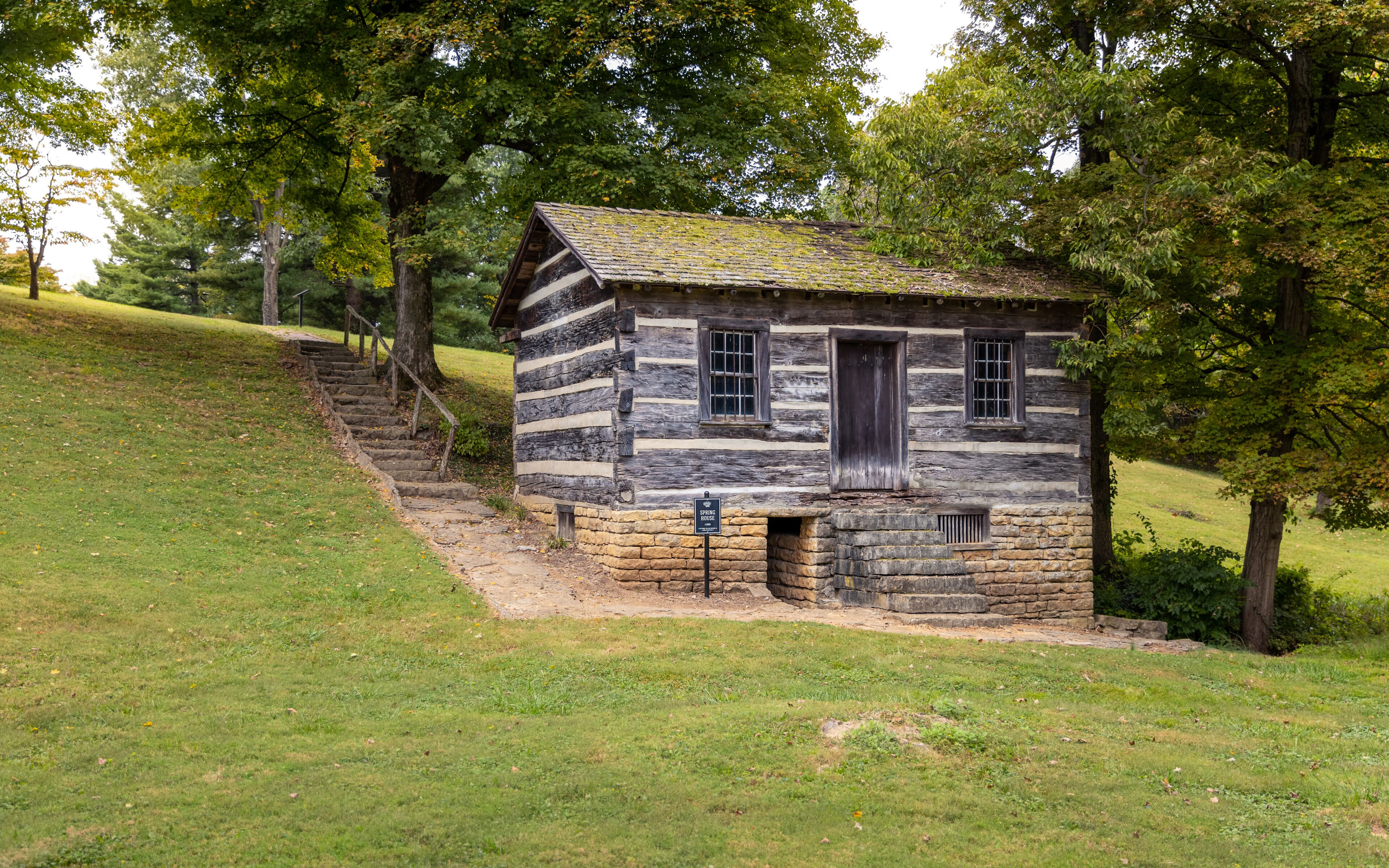 Antique small wood cabin spring house