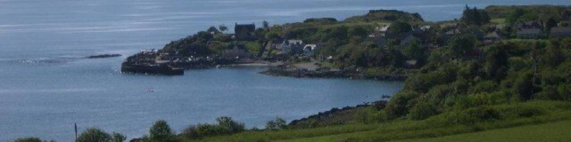 Carradale Harbour. The harbour at Carradale with behind it the Kilbrannan Sound and the Isle of Arran.
