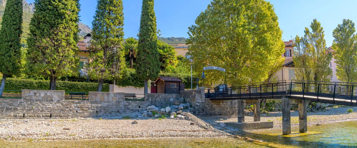 The ferry station and village entrance sign at the Italian town of Abbadia Lariana, Italy, on the shores of Lake Como in Northern Italy.