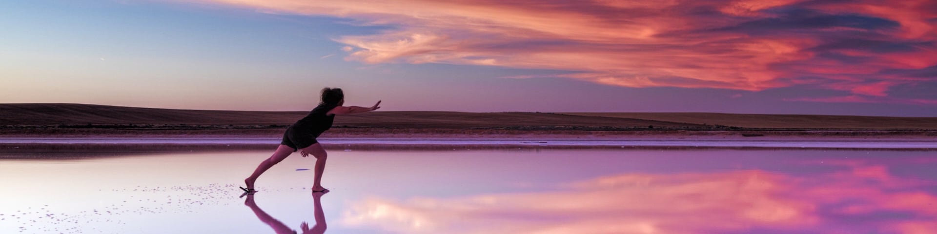 Swan Hill showing a sunset as well as an individual femail