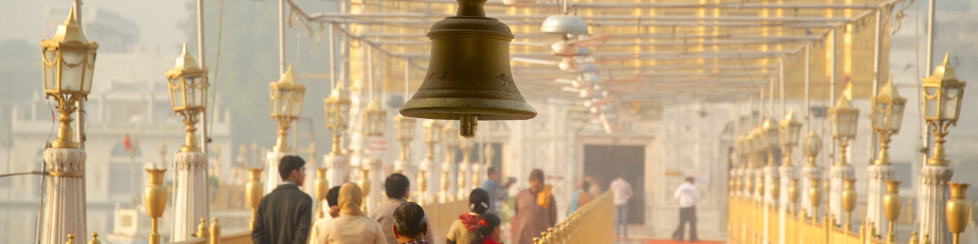 Durgiana Temple which includes a temple or place of worship and heritage elements as well as a small group of people