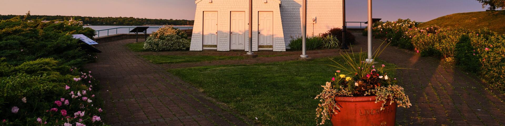 The Fort Point Lighthouse in Liverpool Nova Scotia at sunset makes for striking colors