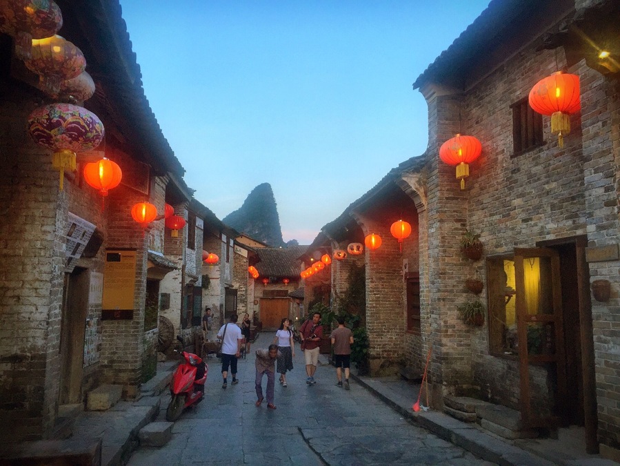 After sunset, red lanterns illuminate this little Chinese village. Huangyao 黄姚 in Guangxi, China.