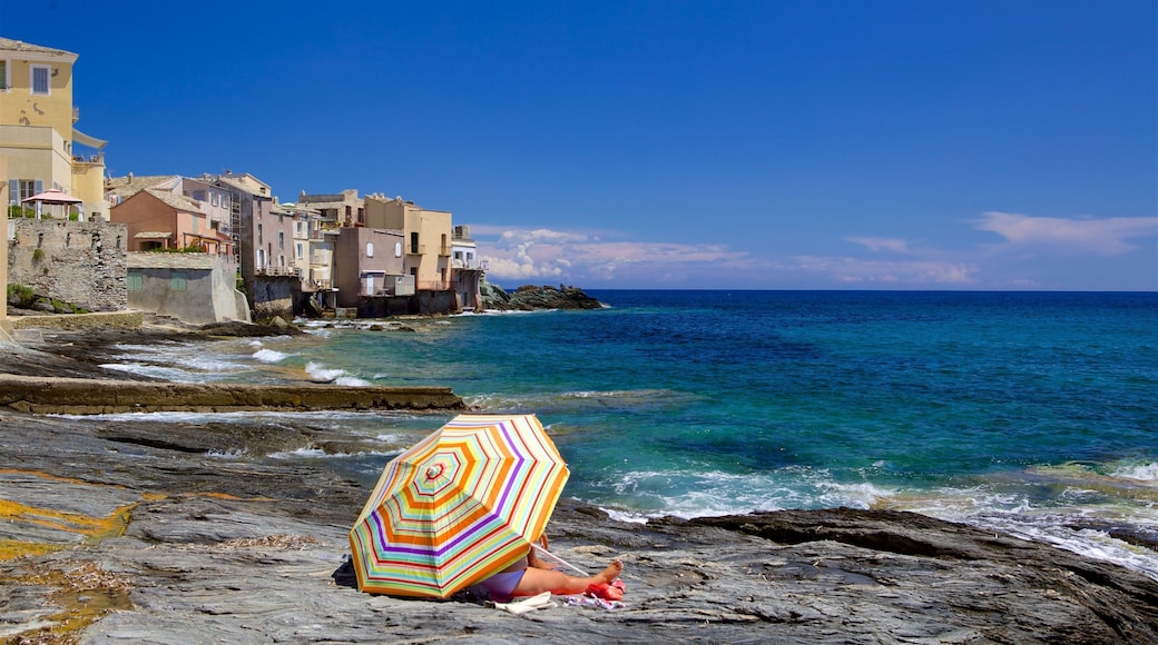Brando featuring a coastal town and rocky coastline