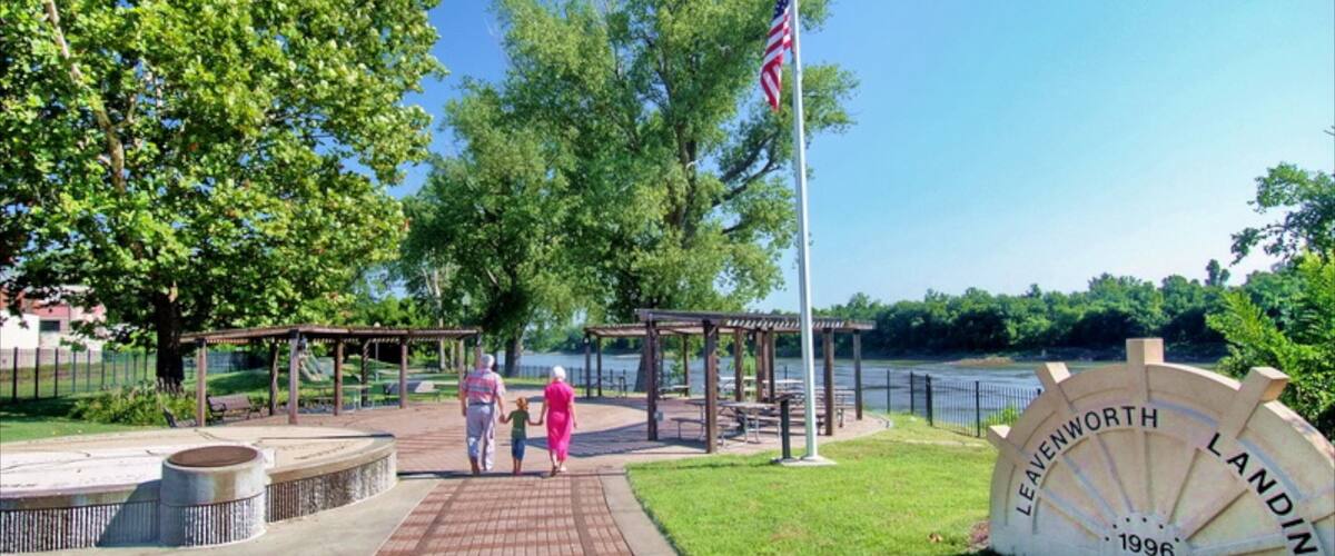 Leavenworth showing signage and a park as well as a family