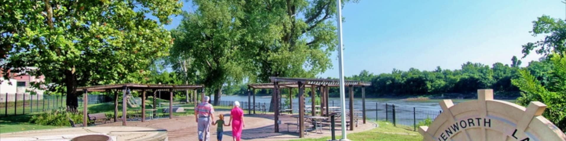 Leavenworth showing signage and a park as well as a family