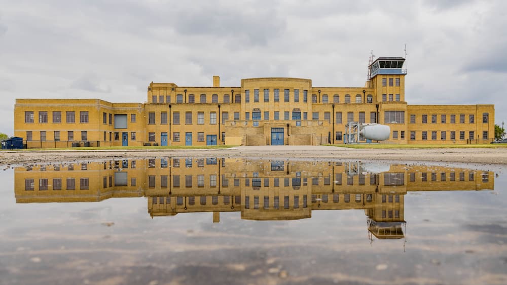 Overcast exteropr view of the Aviation Museum with reflection