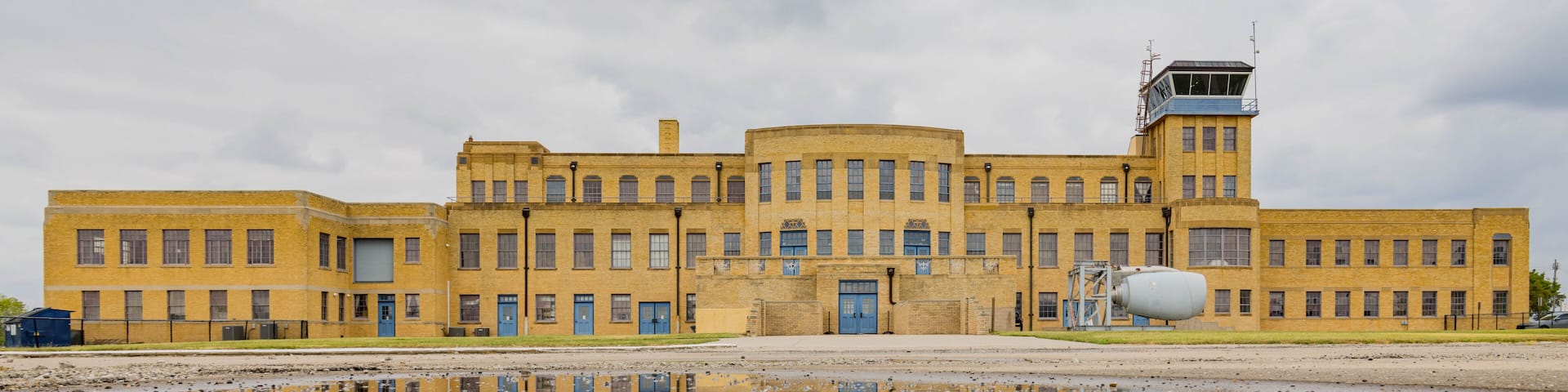 Overcast exteropr view of the Aviation Museum with reflection